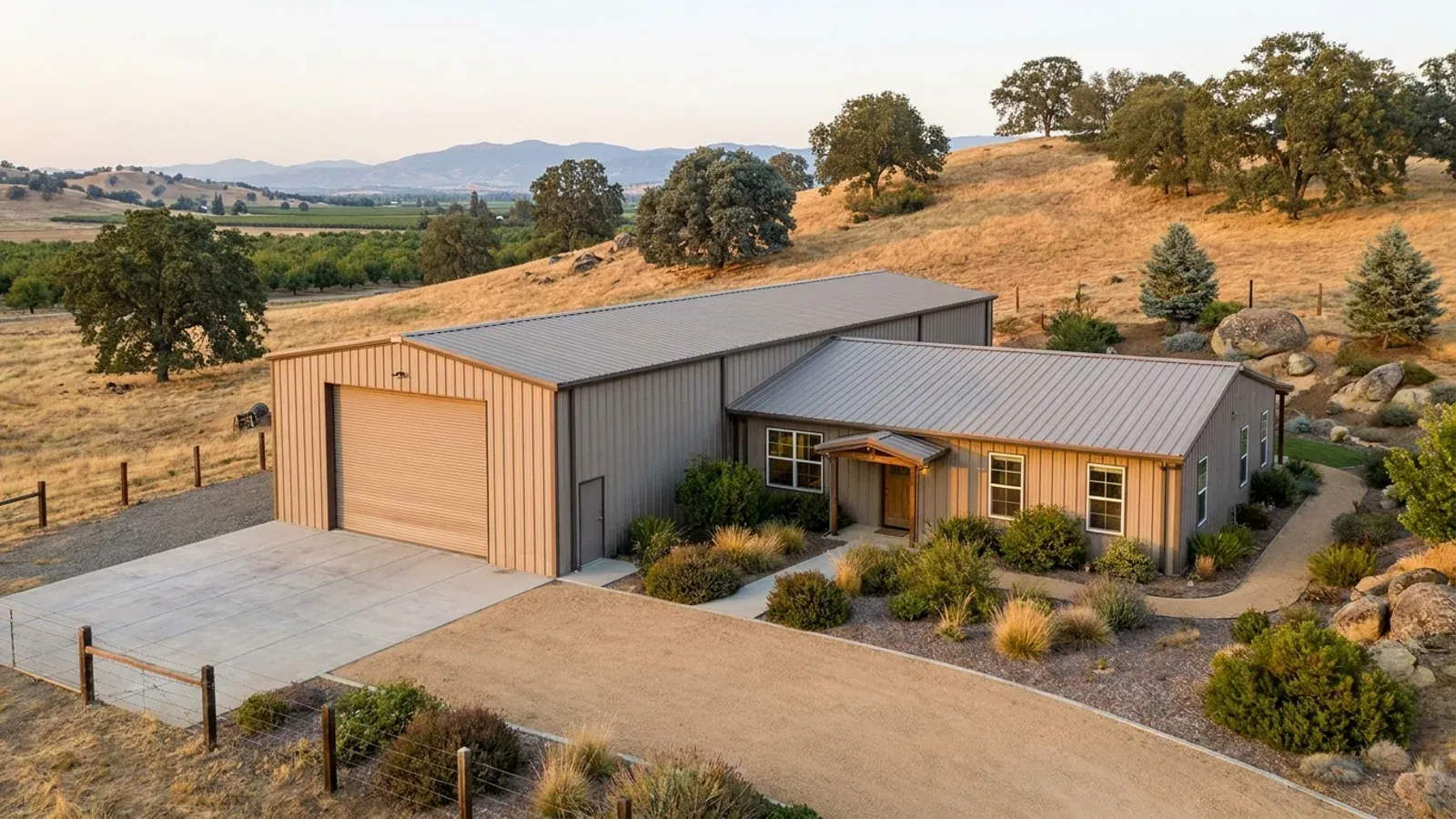 A barndominium with a tall, deep RV garage bay attached to the residence under one continuous roof.